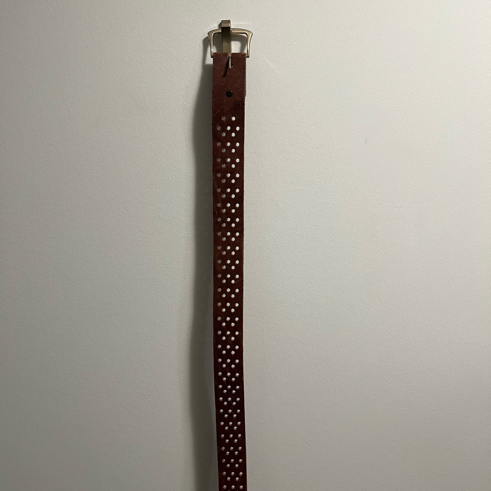 Brown leather belt with hexagon holes